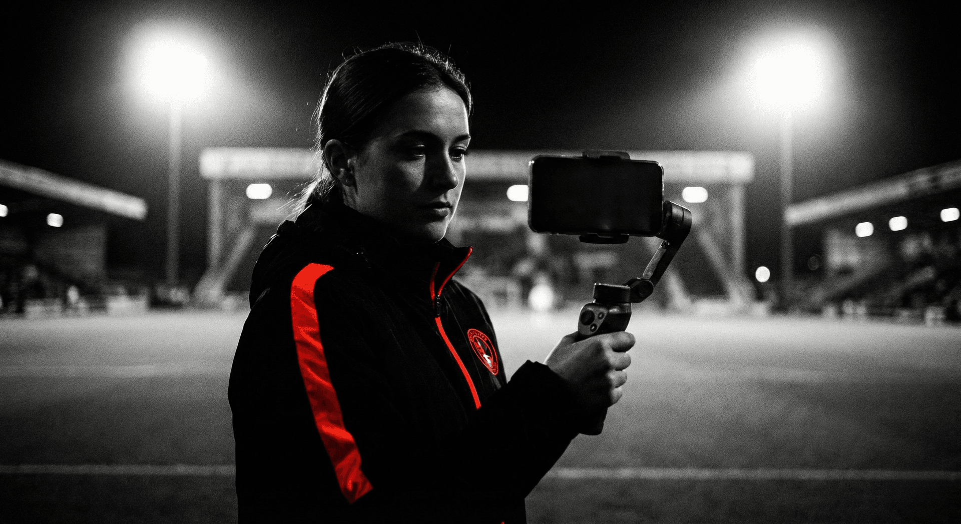 Female creator filming handheld content for a sports campaign
