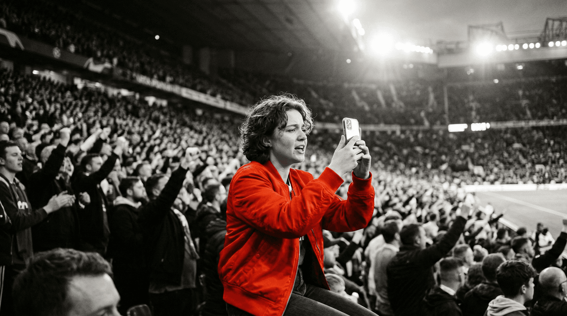 Fan filming matchday content on her phone